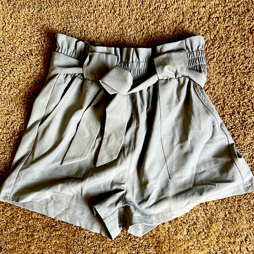 Paper bag style shorts.